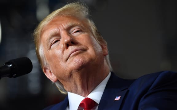 US President Donald Trump speaks during a campaign rally in New Hampshire on 15 August.