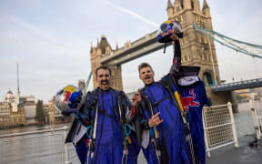 Two Austrian skydivers, Marco Fürst and Marco Waltenspiel, accomplished a remarkable feat by becoming the first individuals to successfully navigate a wingsuit flight through London's iconic landmark, Tower Bridge on May 12, 2024. // Marco Fuerst and Marco Waltenspiel of Austria are seen after their flight through Tower Bridge in London, Great Britain on May 12, 2024. // Joerg Mitter / Red Bull Content Pool (Photo by JOERG MITTER / Red Bull Content Pool / Red Bull Content Pool via AFP)