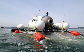 This undated image courtesy of OceanGate Expeditions, shows their Titan submersible being towed to a dive location in Everett, Washington. Rescue teams expanded their search underwater on June 20, 2023, as they raced against time to find a Titan deep-diving tourist submersible that went missing near the wreck of the Titanic with five people on board and limited oxygen. All communication was lost with the 21-foot (6.5-meter) Titan craft during a descent June 18 to the Titanic, which sits at a depth of crushing pressure more than two miles (nearly four kilometers) below the surface of the North Atlantic.