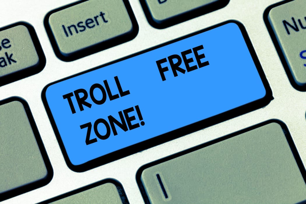 Conceptual hand writing showing Troll Free Zone. Business photo text Social network where tolerance and good behavior is a policy Keyboard key Intention to create computer message idea