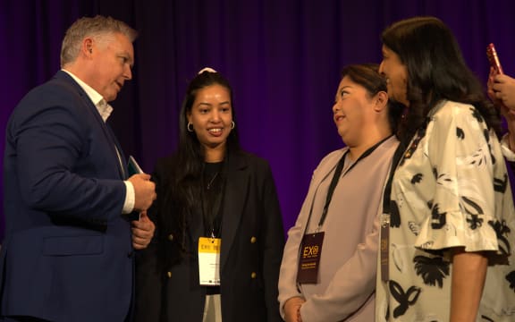 Mark Mitchell with ethnic women entrepreneurs.