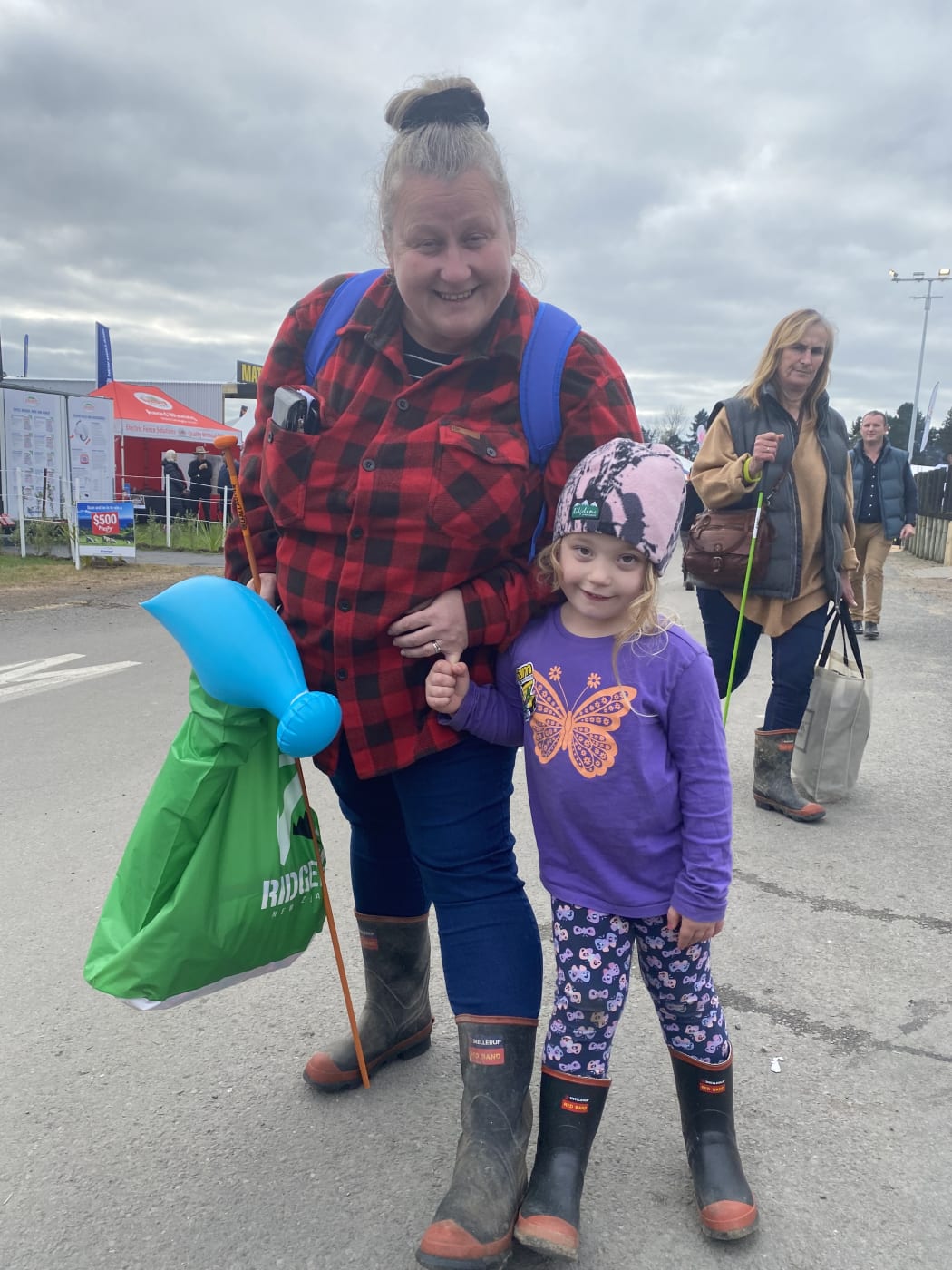 Kelly is wearing an Outback Traders jumper from her favourite Fieldday shop and her favourite Red Bands matching with her daughter's.