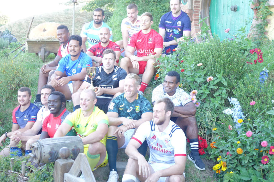 Sevens teams' captains pose for a photo at Hobbiton.