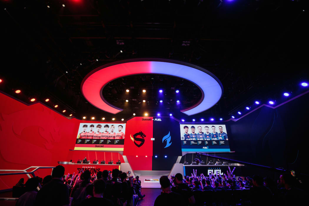The players of the Shanghai Dragons and the Dallas Fuel prepare for a match.