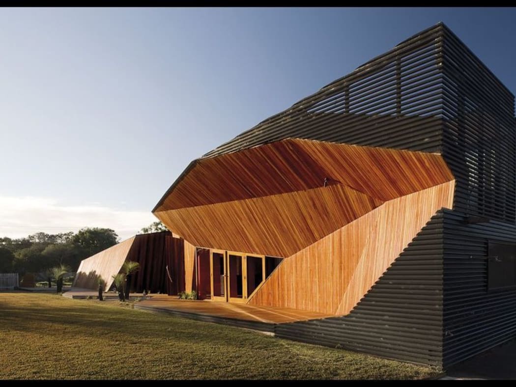 The couple's so-called 'Letterbox House' features a striking wood panel.