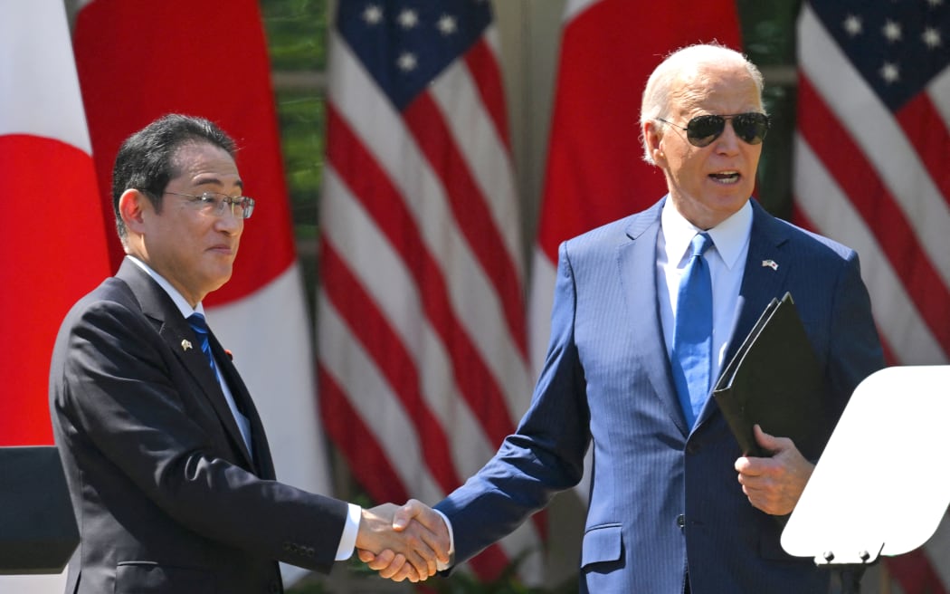 US President Joe Biden and Japanese Prime Minister Fumio Kishida shake hands after a joint press conference in the Rose Garden of the White House in Washington, DC, on 10 April, 2024.