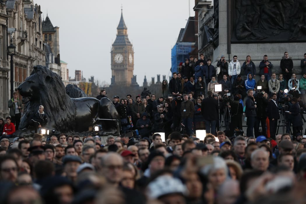 People gather for a vigil in Trafalgar Square in central London on March 23, 2017 in solidarity with the victims of the March 22 terror attack at the British parliament and on Westminster Bridge. Britain's parliament reopened on Thursday with a minute's silence in a gesture of defiance.