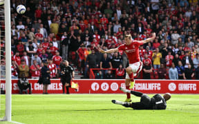 Nottingham Forest's New Zealand striker Chris Wood watches his shot go over the bar during the English Premier League football match against Chelsea at The City Ground in Nottingham, 25 May, 2025.