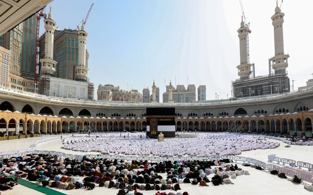 Muslim worshippers pray around the Kaaba, Islam's holiest shrine, at the Grand Mosque in Saudi Arabia's holy city of Mecca on June 4, 2024 as pilgrims arrive ahead of the annual hajj pilgrimage. (Photo by Abdel Ghani BASHIR / AFP)