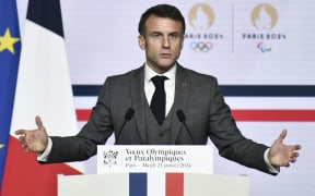 French President Emmanuel Macron delivers a speech ahead of the Paris 2024 Olympic Games.