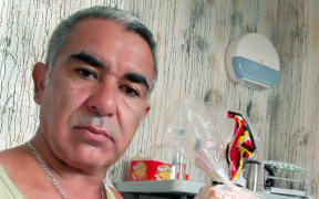Hassan Ghahramani with a loaf of mouldy bread