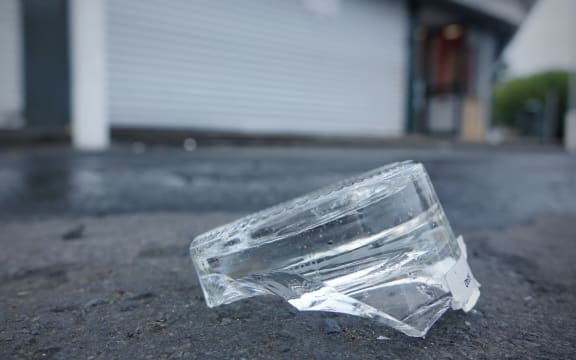 Broken glass outside the Sharland Avenue liquor store.