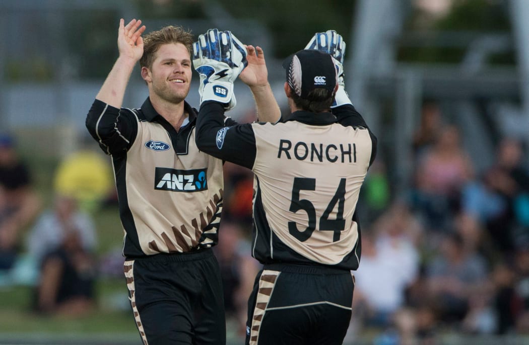 New Zealand's Lockie Ferguson and Luke Ronchi celebrate a wicket.