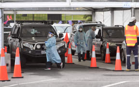People queue for Covid-19 coronavirus tests in the Melbourne suburb of St Kilda