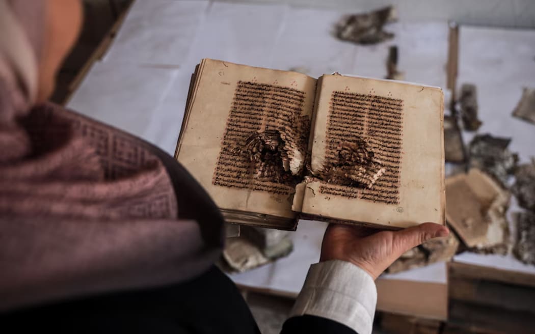 A damage book found in the debris of the Great Omari Mosque in Gaza City.
