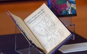 Hand-written notes by author J.K. Rowling are pictured inside a rare first edition of her book 'Harry Potter and the Philosopher's Stone' displayed at The National Library of Scotland on June 26, 2017.