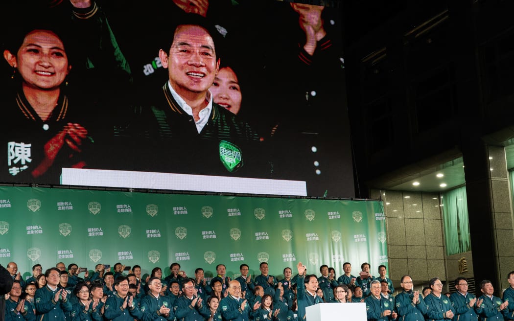 William Lai (Lai Ching-Te), the candidate of the Democratic Progressive Party, celebrates his election as president of the Republic of Taiwan on stage at their party headquarters with his running mate Hsiao Bi-Khim. Photograph by Jimmy Beunardeau / Hans Lucas