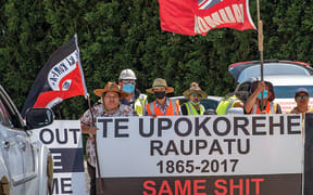 Members of Te Ūpokorehe protest their inclusion in the Whakatōhea Treaty settlement at the initialing of the settlement in December.