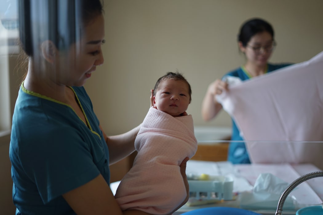 midwife and baby