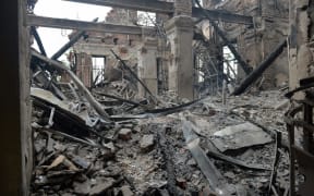 A view of a school destroyed as a result of fighting not far from the centre of the Ukrainian city Kharkiv, located some 50 km from the Ukrainian-Russian border, on 28 February, 2022.