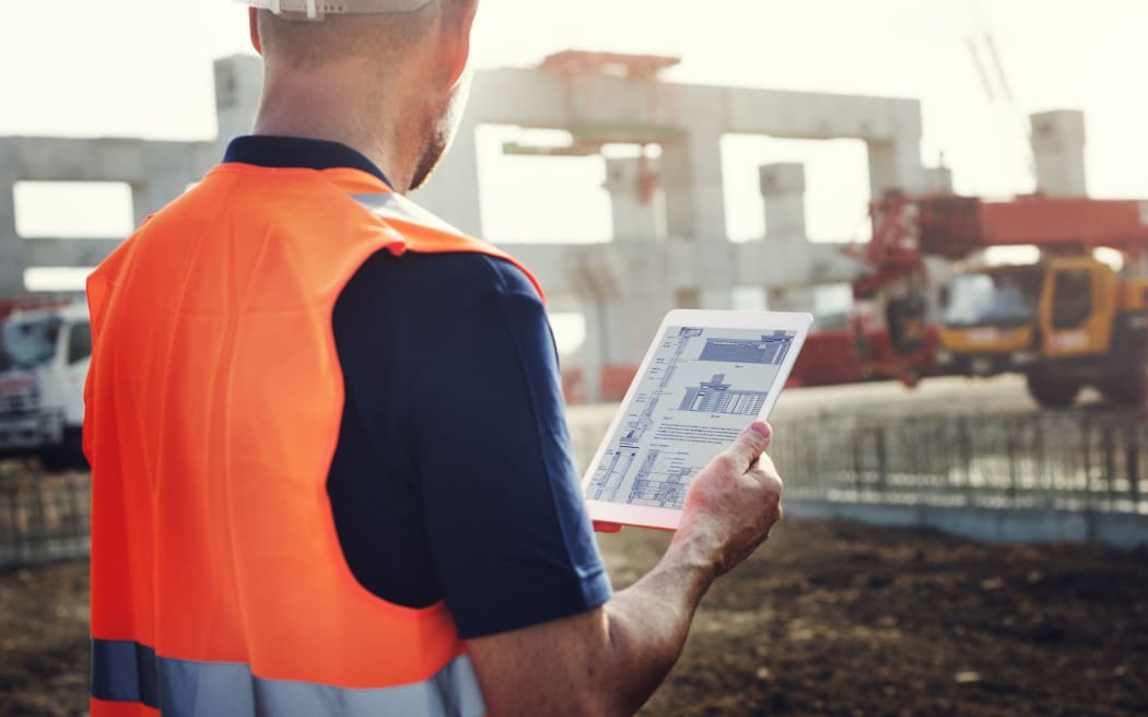 61640355 - construction worker planning contractor developer concept