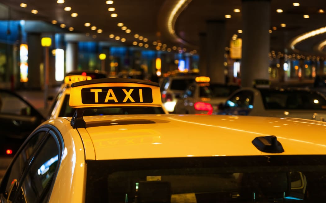 A file photo of a line of taxis at an airport