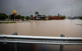 Floods from an overflowing Oxley Creek inundate roads at Rocklea, Australia's Queensland state on February 26, 2022.