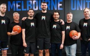 Melbourne United support Isaac Humphries (centre) who told his NBL team he is gay.
