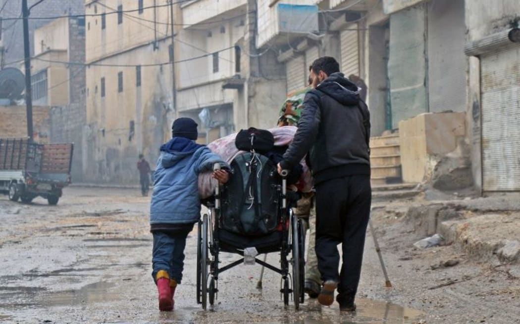 Syrian civilians leave towards safer rebel-held areas in Aleppo during an operation by Syrian government forces to retake the embattled city.