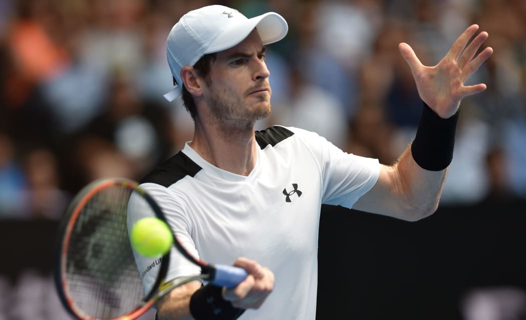 Andy Murray returns against David Ferrer at the 2015 Australian Open in Melbourne, January 27, 2016. AFP PHOTO / SAEED KHAN