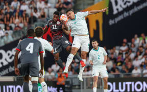 New Zealand's Michael Boxall New Caledonia's César Zeoula.