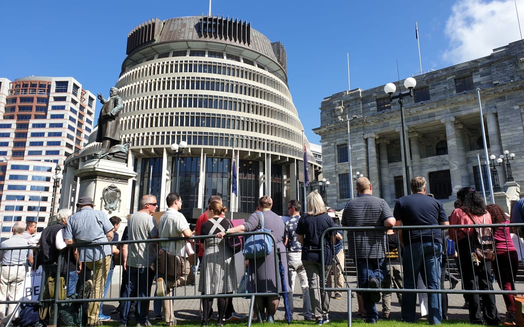 Migrant family protest outside Parliament