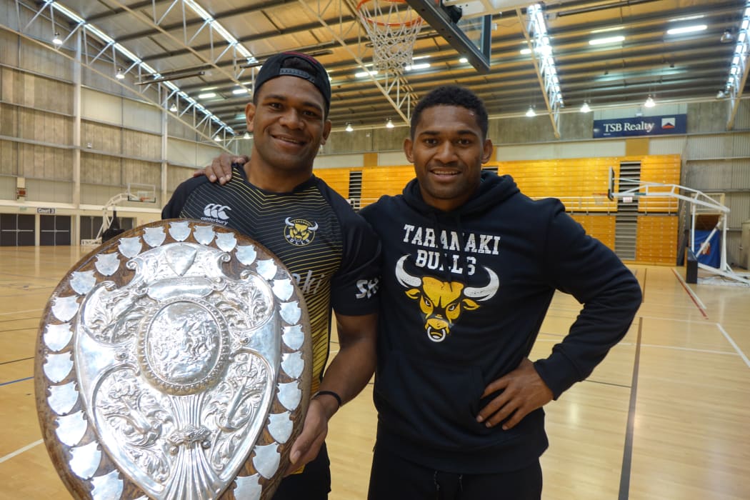 Seta Tamanivalu and Waisake Naholo holding the Ranfurly Shield at training at the TSB Stadium.
