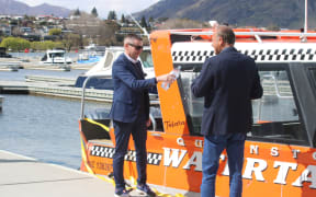 Julian Phillips and Iraj Barabi at a ribbon-cutting ceremony in Queenstown on Monday.