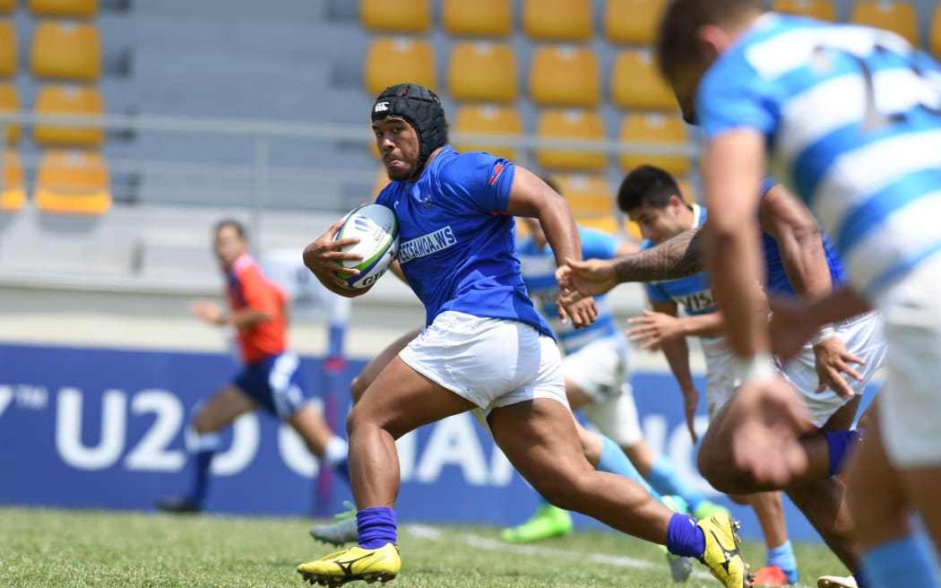 Samoa's replacement hooker Frank Tupuola charges clear.