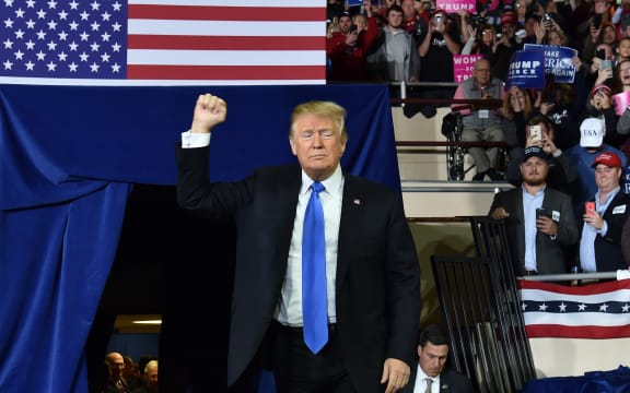 US President Donald Trump arrives to a "Make America Great Again" rally at the Eastern Kentucky University, in Richmond, Kentucky, on October 13, 2018. (Photo by Nicholas Kamm / AFP)