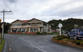 View of main street in the lone town of Oban on Stewart Island towards a hotel.