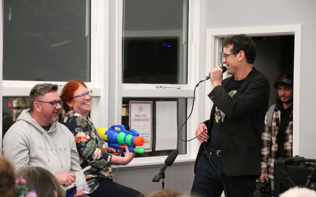 Timekeepers at the Aro Valley general election debate keep Scott Sheeran of the National Party in check on 1 September, 2023.