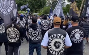 Patched Black Power members at a gathering.