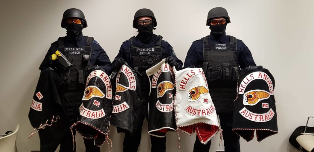 Some members of New South Wales Police's Strike Force Raptor team, with gang members' jackets.