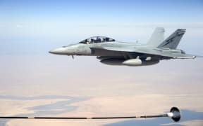 A Royal Australian Air Force (RAAF) F/A-18F Super Hornet above Iraq in 2014.