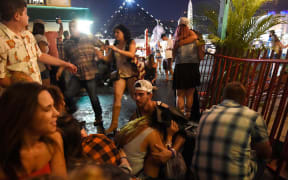 People in Las Vegas run for cover during the mass shooting.