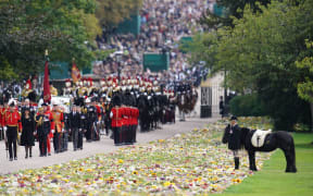 Emma, the monarch's fell pony stands by, as the procession following the coffin of Queen Elizabeth II, aboard the State Hearse, travels up The Long Walk in Windsor on September 19, 2022, making its final journey to Windsor Castle after the State Funeral Service of Britain's Queen Elizabeth II. (Photo by Andrew Matthews / POOL / AFP)