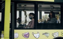 Bus passengers wearing masks during level 2, Wellington 15 February 2021