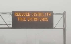 A sign on an Auckland motorway warning motorists to take care in foggy conditions.