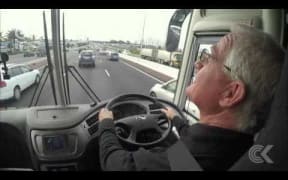 Auckland mayoral candidates take bus ride with John Campbell