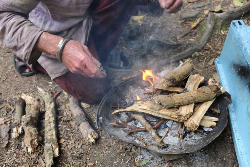 Pete lights a fire to boil water. He is largely self sufficient.