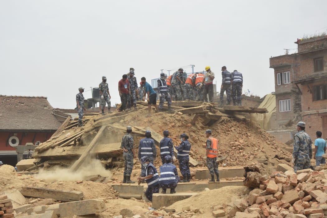 Nepalese soldiers clear debris at Rato Machhindranath temple, Bungamati. 18 May 2015.