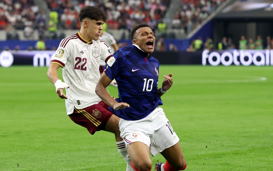 ARLINGTON, TEXAS - JULY 14: Kylian Mbappe #10 of France is challenged by Pau Cubarsi #22 of Spain during the FIFA World Cup 2026 Semi Final match between France and Spain at Dallas Stadium on July 14, 2026 in Arlington, Texas. (Photo by Florencia Tan Jun/Getty Images)
