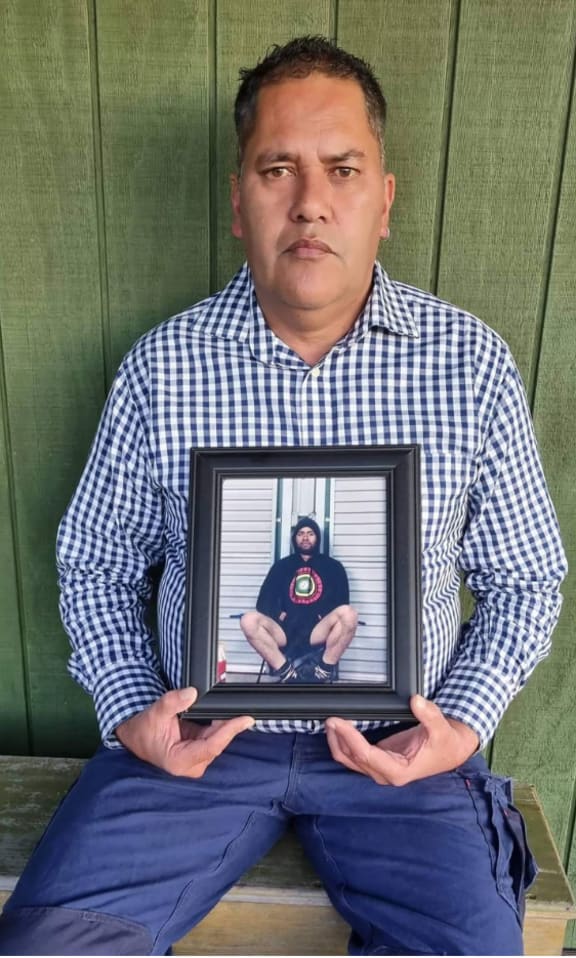 Richard Brooking holding a photograph of his son Niko O'Neill Brooking-Hodgson, 24, who died in a forestry accident in August 2016. NZ Herald image.